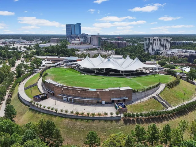 a view of a swimming pool with a garden