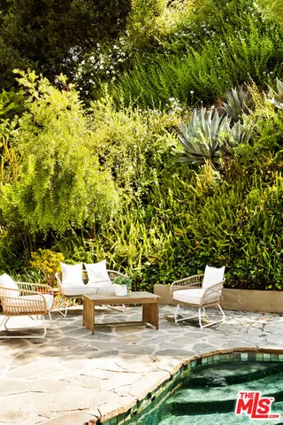 a view of house with a tree