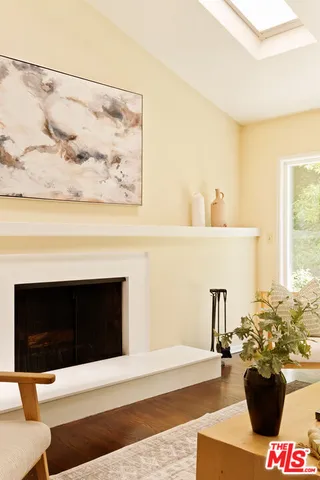 a living room with a couch and a fireplace