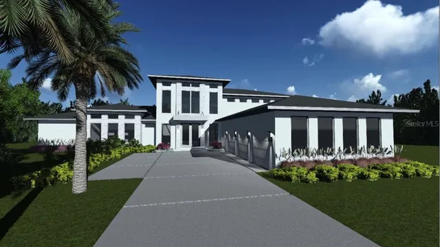 a view of a house with a yard and pathway