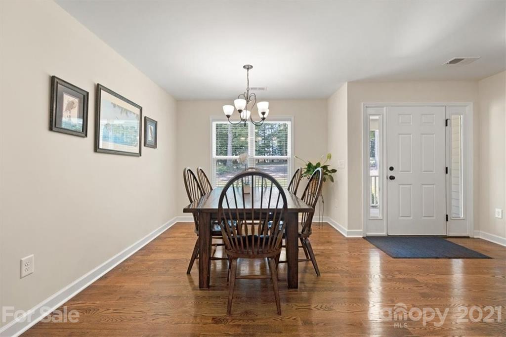 769 Shady Forest Road Clover, SC 29710 - Photo 11 of 36 a view of a dining room with furniture window and wooden floor