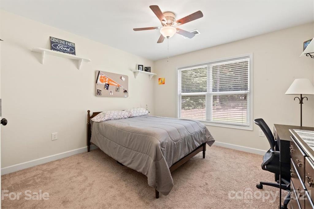 769 Shady Forest Road Clover, SC 29710 - Photo 21 of 36 a bedroom with a bed and a large window