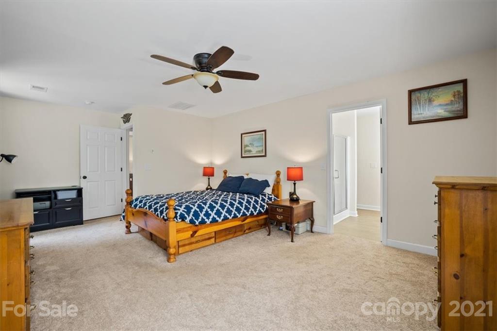 769 Shady Forest Road Clover, SC 29710 - Photo 24 of 36 a bed room with a bed and a chair