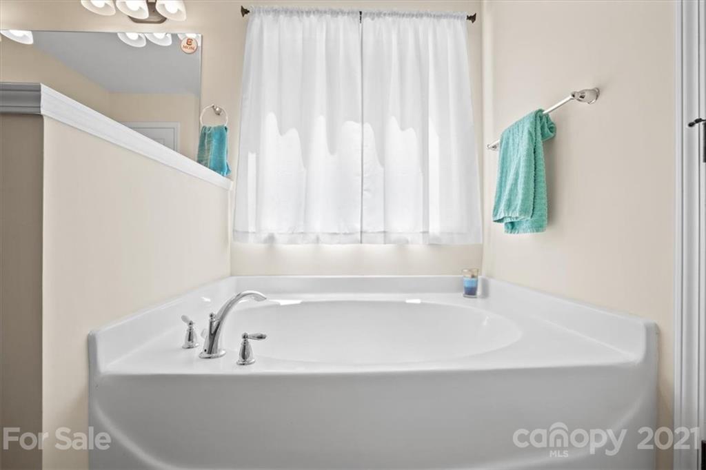 769 Shady Forest Road Clover, SC 29710 - Photo 29 of 36 a white bath tub sitting in a bathroom