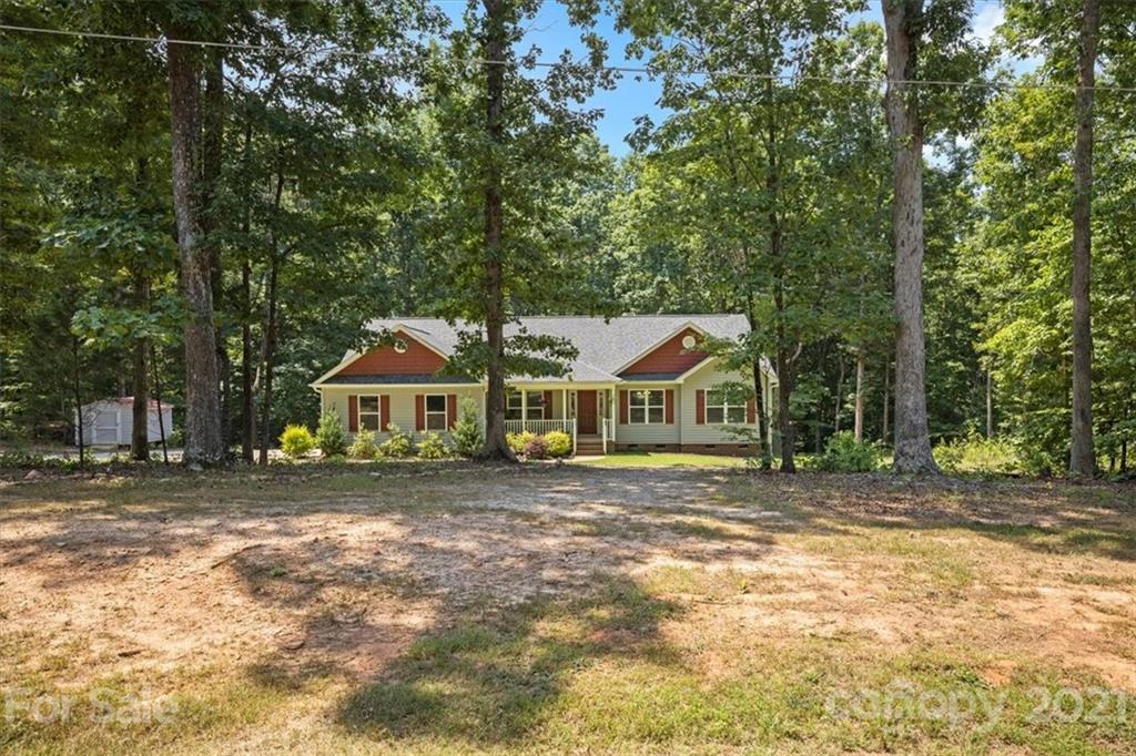 769 Shady Forest Road Clover, SC 29710 - Photo 31 of 36 a front view of a house with a garden
