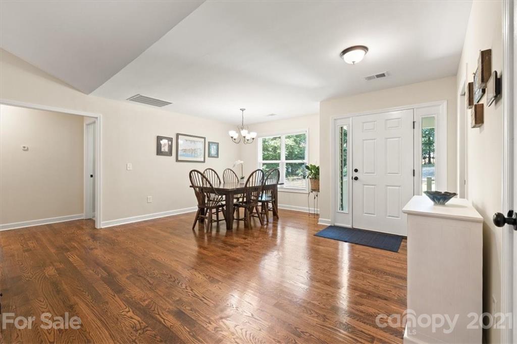 769 Shady Forest Road Clover, SC 29710 - Photo 9 of 36 a view of a dining room with furniture and wooden floor