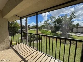 a view of a backyard with sitting area