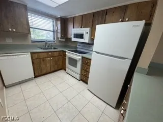 a white refrigerator freezer sitting inside of a kitchen