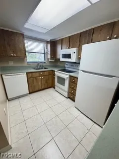 a kitchen with stainless steel appliances a refrigerator sink and cabinets