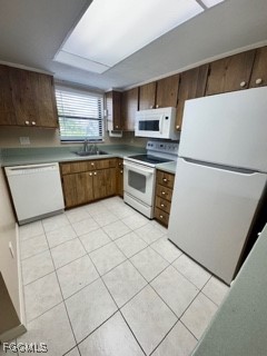 16805 Davis Road, Unit 123 Fort Myers, FL 33908 - Photo 6 of 16 a kitchen with stainless steel appliances a refrigerator sink and cabinets