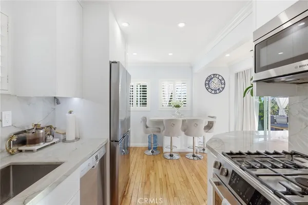 a kitchen with a stove and a refrigerator