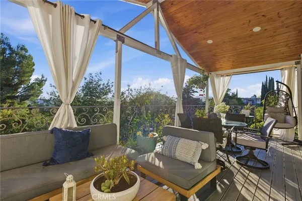 a outdoor living space with furniture and a potted plant