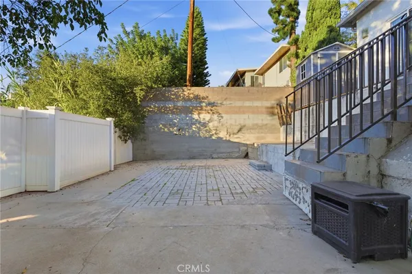 a view of a backyard of the house