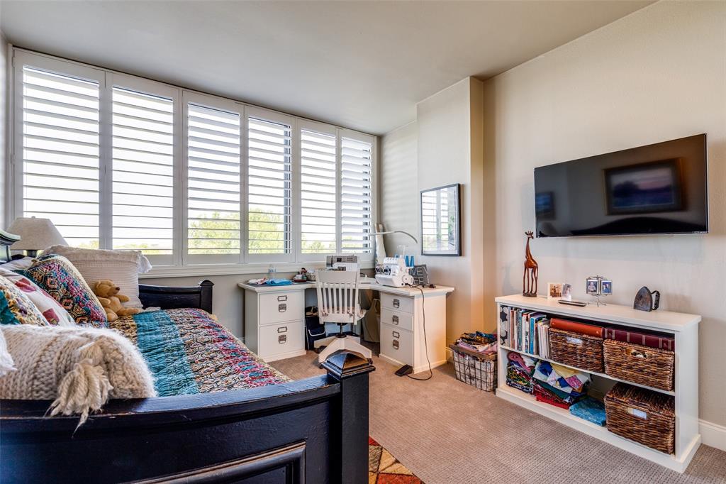 5200 Keller Springs Road, Unit 535 Dallas, TX 75248 - Photo 13 of 25 a bed room with a bed and a television