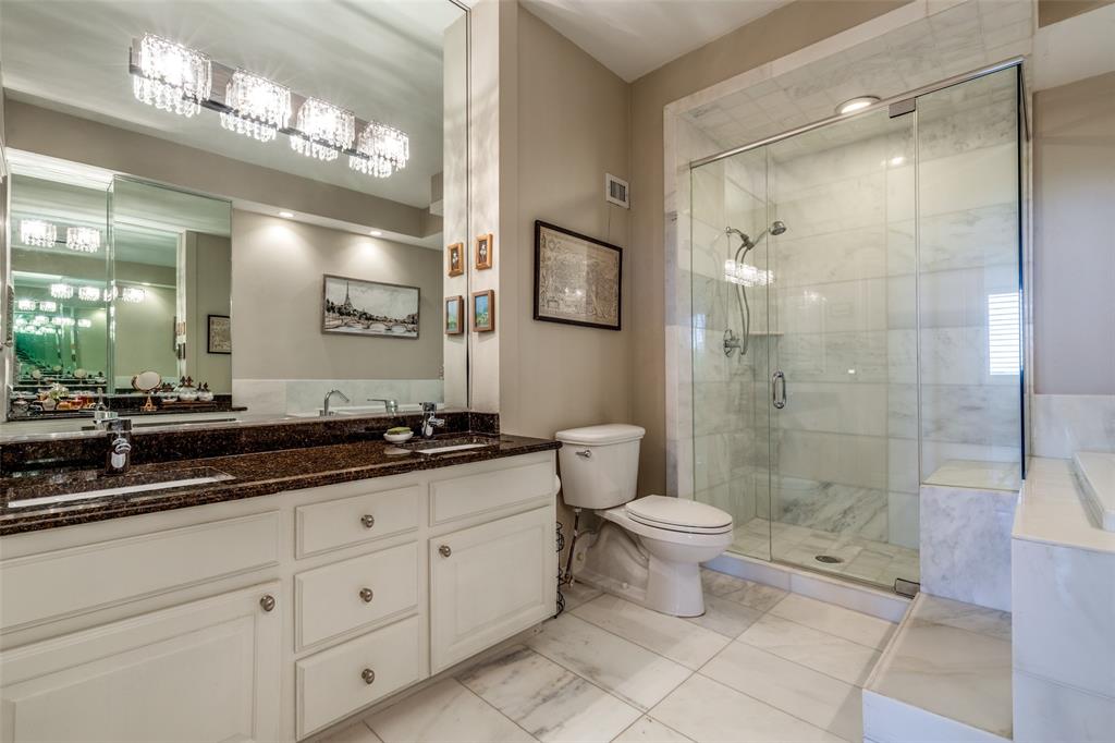 5200 Keller Springs Road, Unit 535 Dallas, TX 75248 - Photo 14 of 25 a bathroom with a double vanity sink toilet and a shower