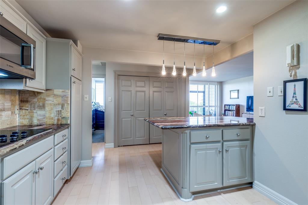 5200 Keller Springs Road, Unit 535 Dallas, TX 75248 - Photo 8 of 25 a kitchen with counter top space cabinets and appliances