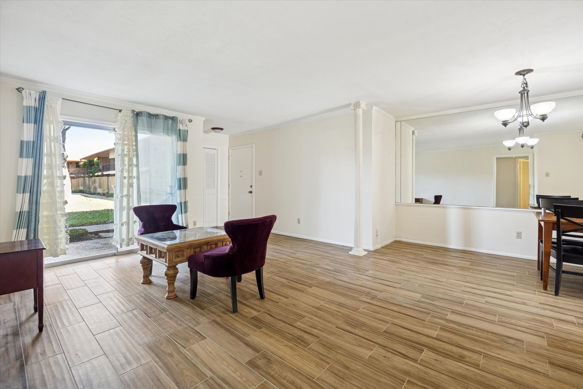a view of a livingroom with furniture and wooden floor