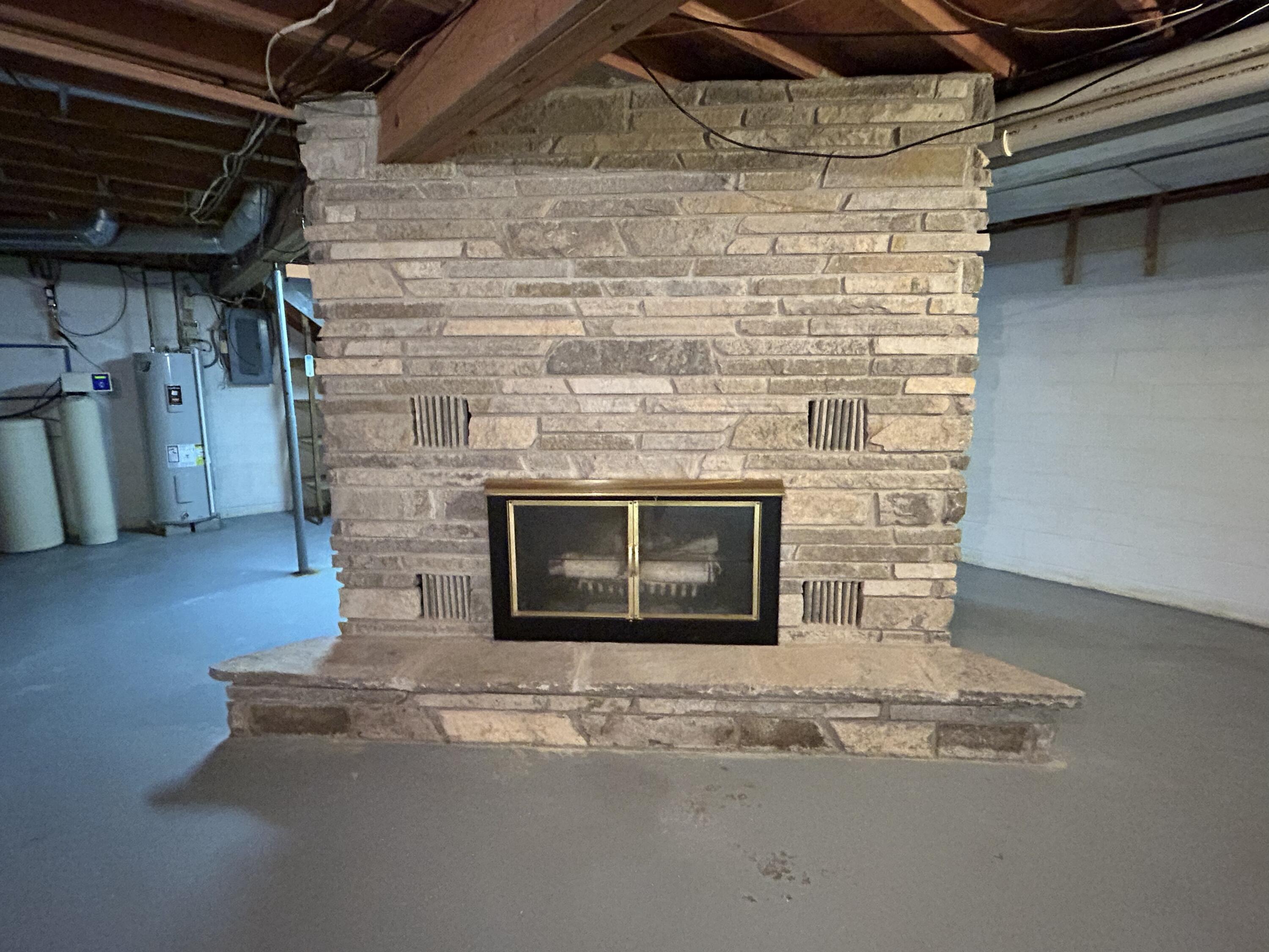 8887 Galbraith Road Cheboygan, MI 49721 - Photo 25 of 38 basement fireplace