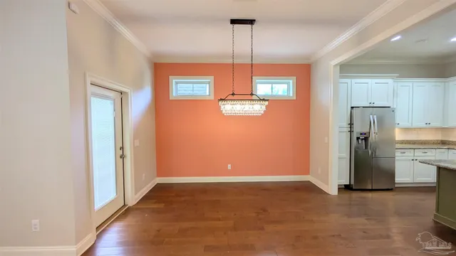 a view of a kitchen with a refrigerator a sink and dishwasher