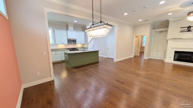 a view of a kitchen with a sink and a stove top oven