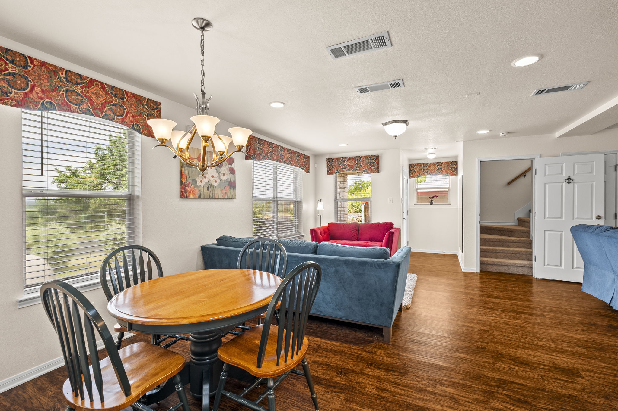 1427 River Ridge Ranch Road Killeen, TX 76549 - Photo 20 of 40 Downstairs, an inviting open-concept living and dining area features rich wood flooring and separate exterior entrance.
