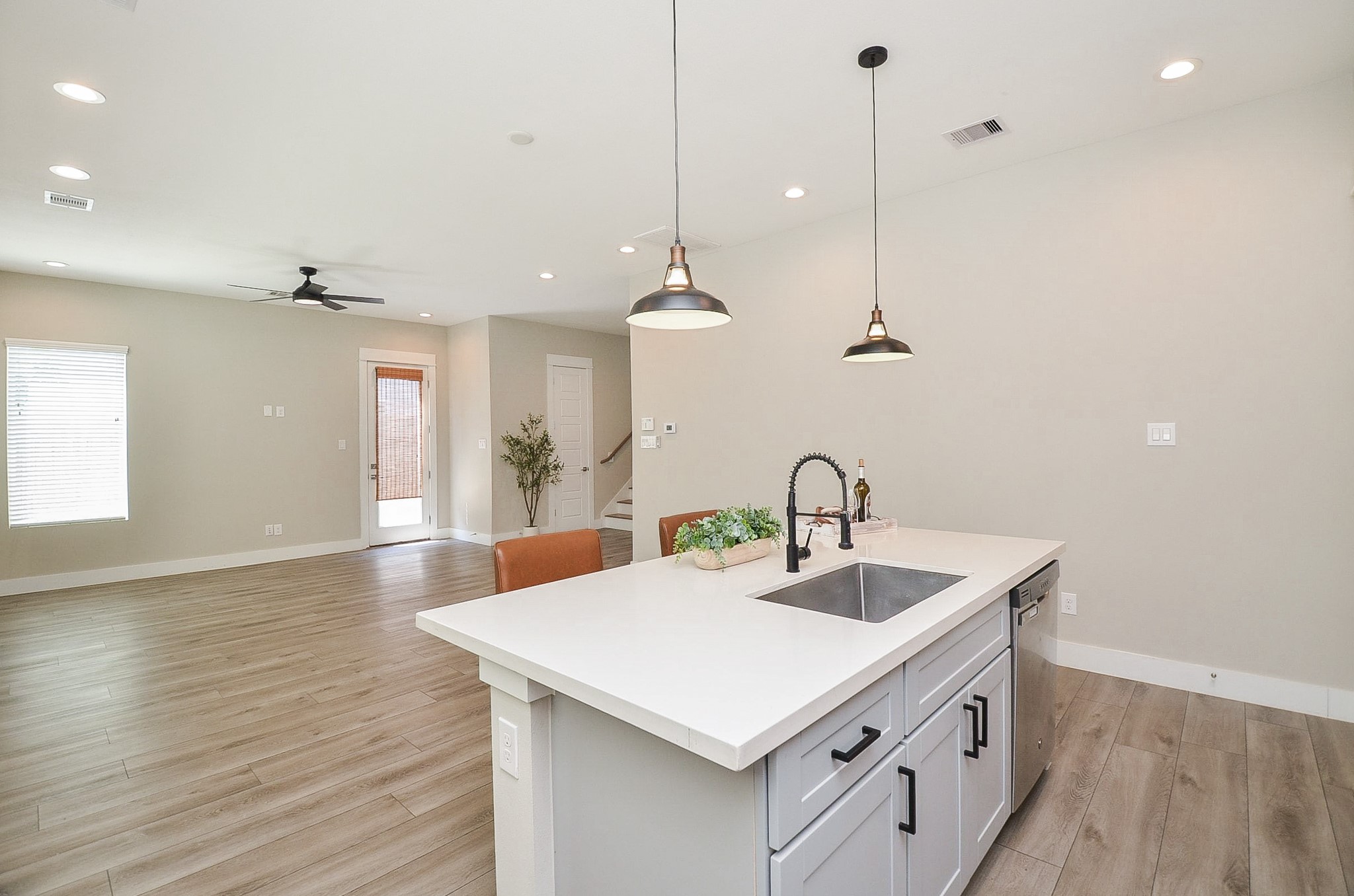 Experience the perfect blend of modern design and functionality with ample open space ideal for creating distinct dining and living areas.