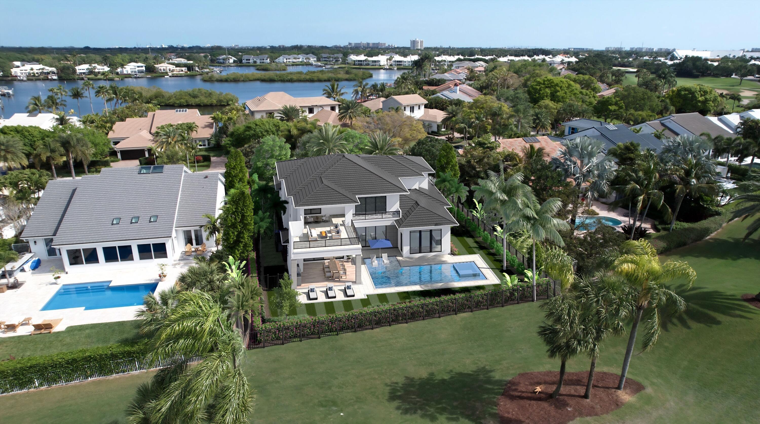 112 Regatta Drive Jupiter, FL 33477 - Photo 3 of 17 an aerial view of a house with a garden and lake view