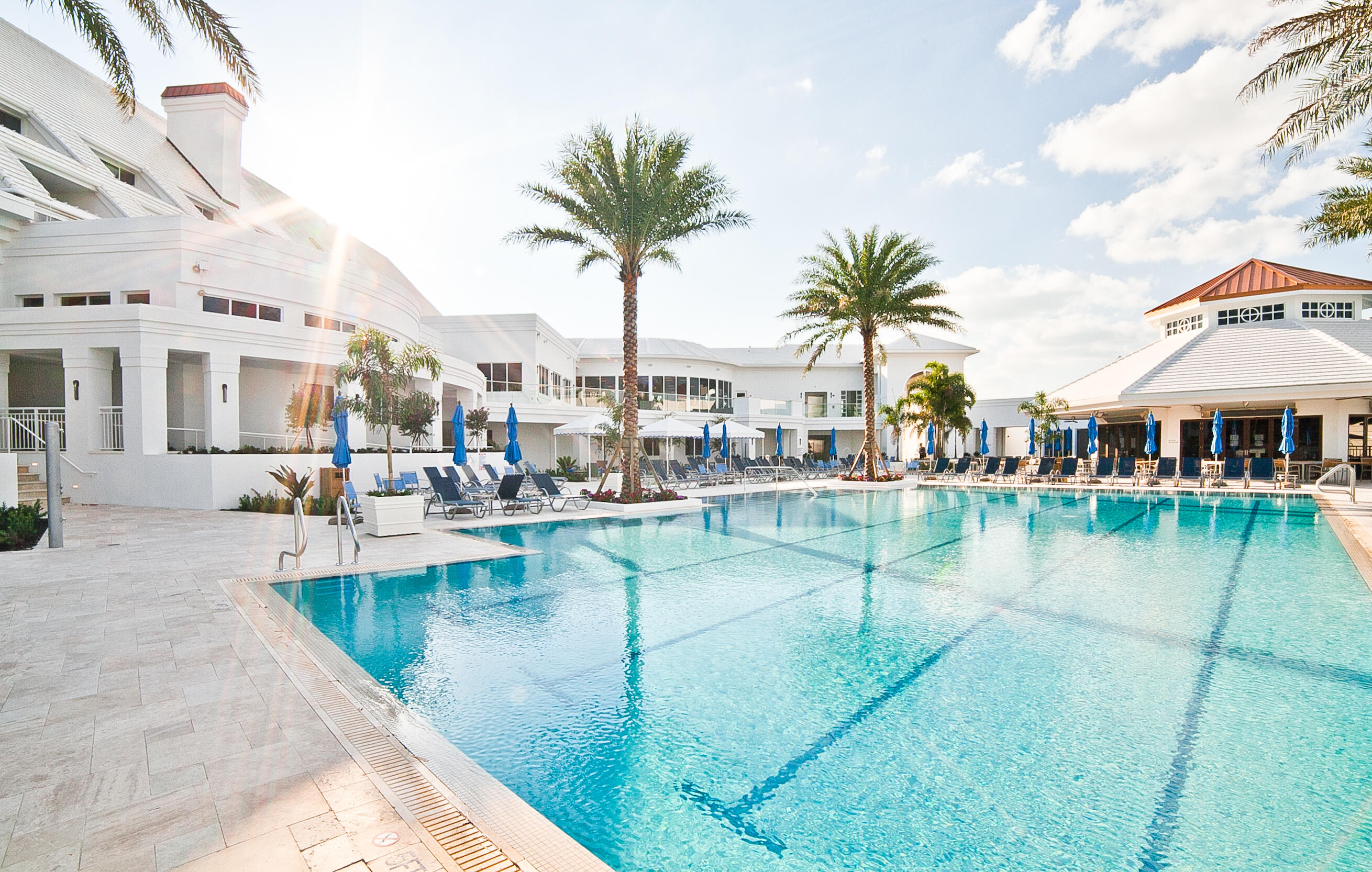 112 Regatta Drive Jupiter, FL 33477 - Photo 8 of 17 a view of a swimming pool with outdoor seating