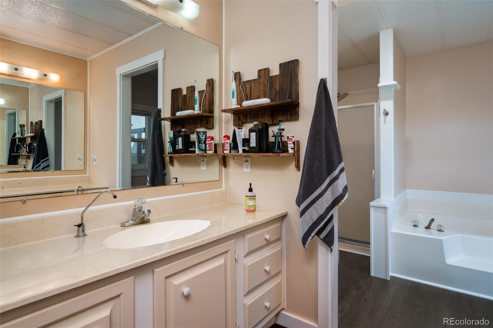 97862 E Highway Hayden, CO 81639 - Photo 14 of 30 a bathroom with a sink double vanity and a tub