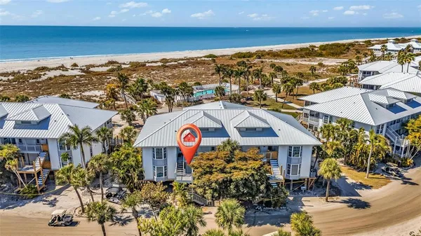 an empty room with wooden floor and mirror