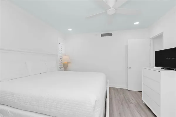 a bathroom with a sink vanity and a mirror