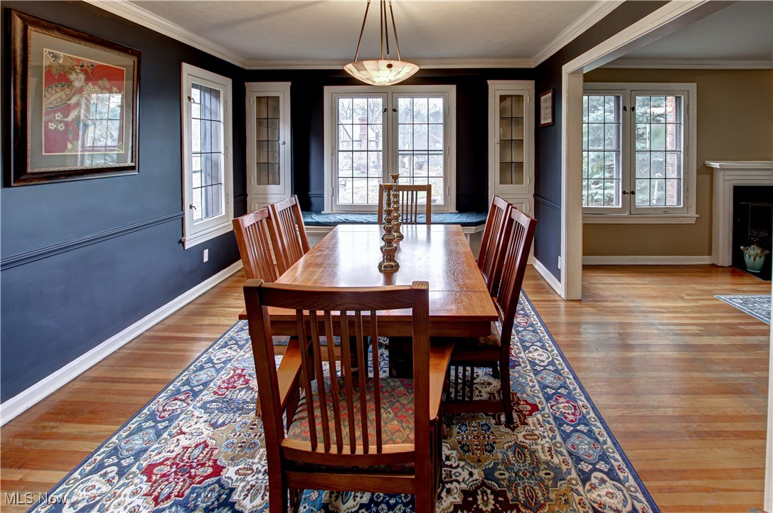 17800 Winslow Road Beachwood, OH 44122 - Photo 11 of 31 Dining room featuring a wealth of natural light, crown molding, and light wood-type flooring