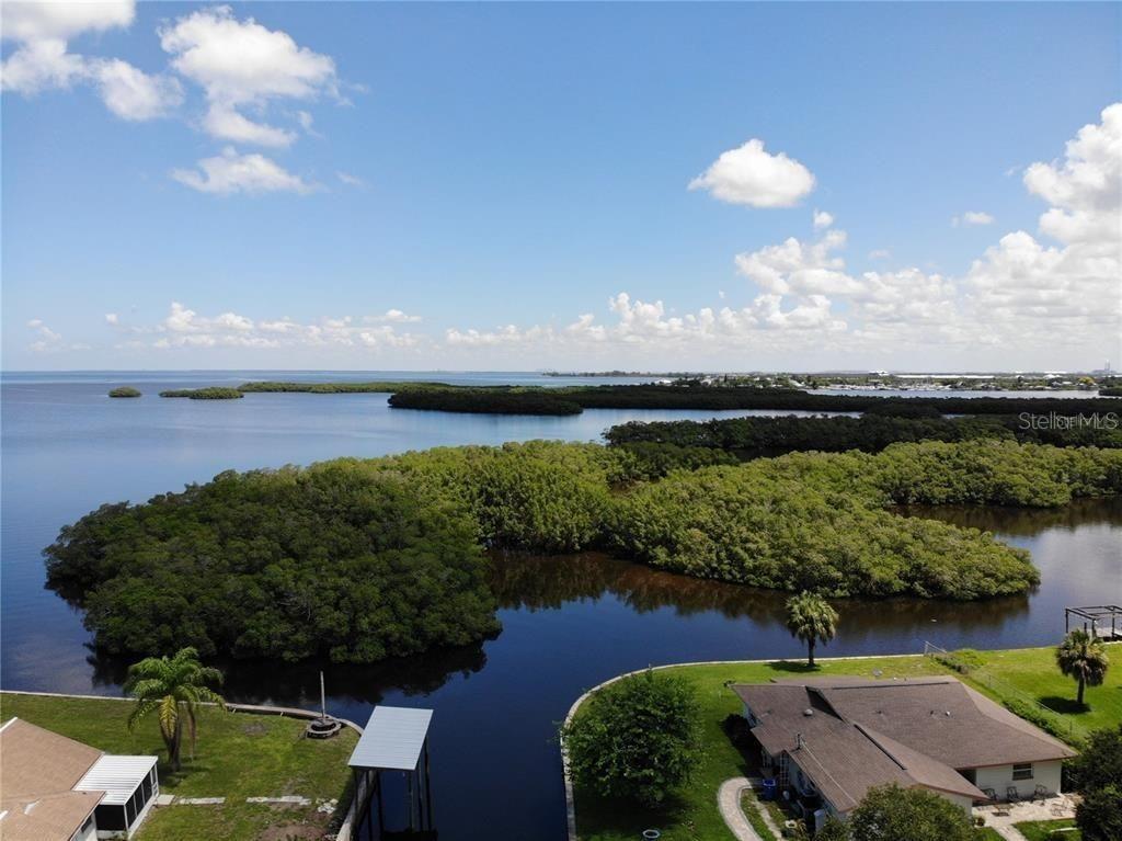 Canal Street Ruskin, FL 33570 - Photo 11 of 14 an aerial view of a houses with outdoor space lake and green space