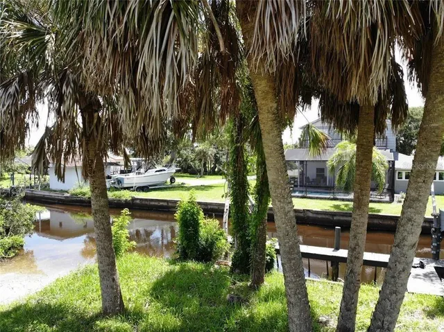 a view of swimming pool with a table and chairs