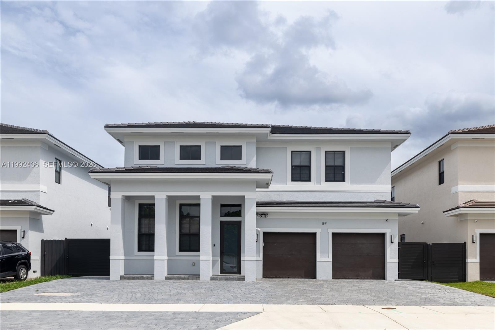 1841 Southwest 145th Avenue, Unit 1841 Miami, FL 33175 - Photo 1 of 23 a front view of a house with a garage