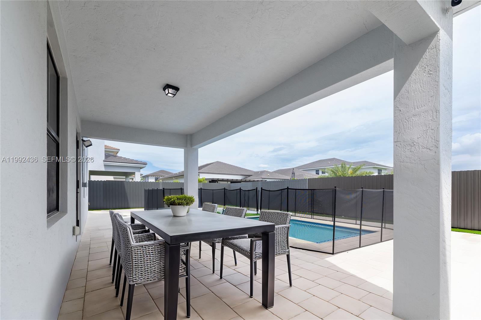 1841 Southwest 145th Avenue, Unit 1841 Miami, FL 33175 - Photo 20 of 23 a view of a dining room with furniture window and outside view