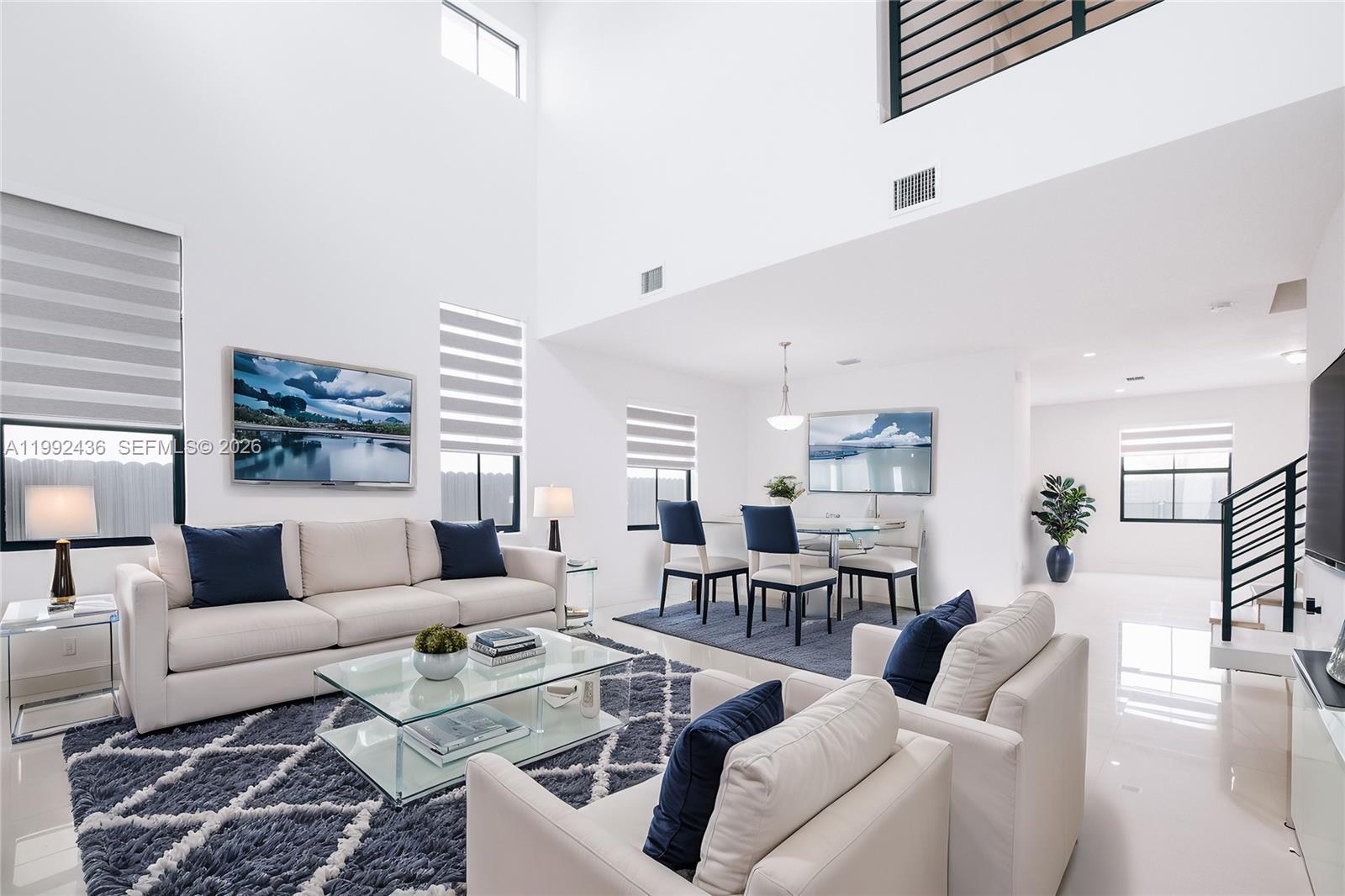 1841 Southwest 145th Avenue, Unit 1841 Miami, FL 33175 - Photo 3 of 23 a living room with furniture and a large window