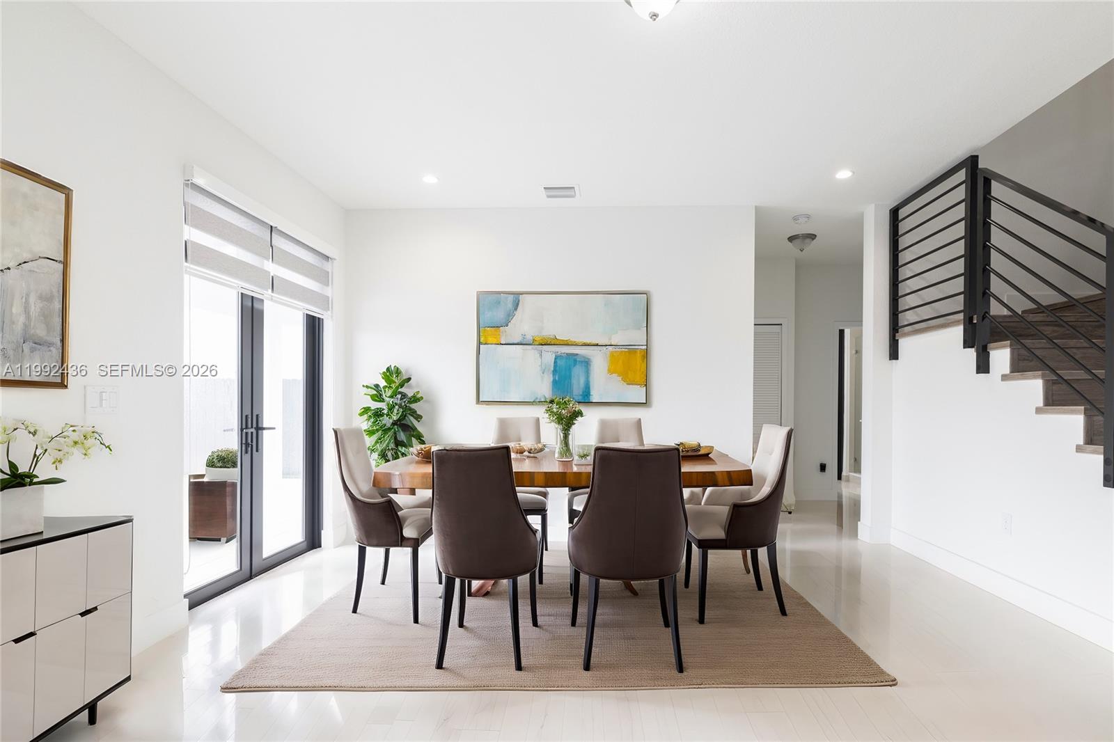 1841 Southwest 145th Avenue, Unit 1841 Miami, FL 33175 - Photo 4 of 23 a view of a dining room with furniture and wooden floor