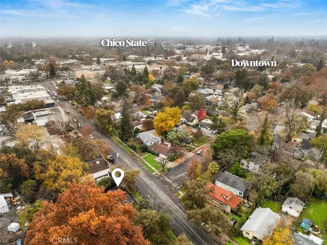 a front view of a house with a garden and plants