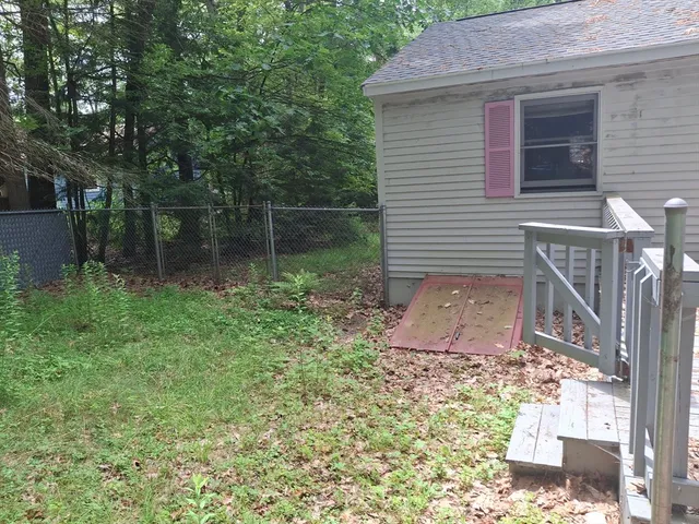 a backyard of a house with lots of green space