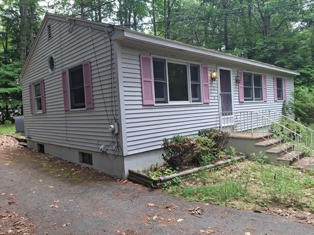 a view of a house and a yard