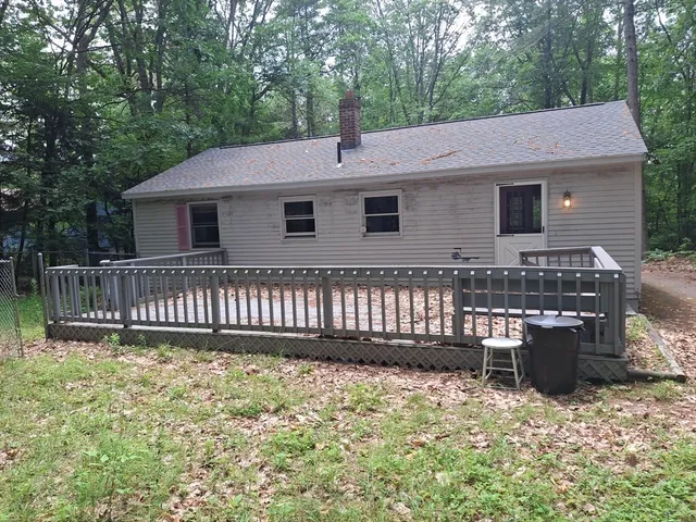 a backyard of a house with a deck
