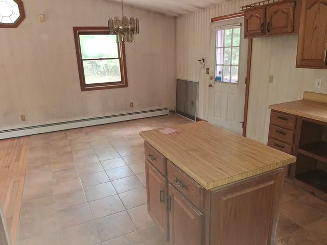 a room that has a bed and a window in it