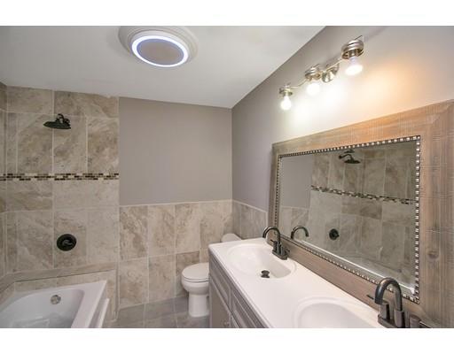 41 Florida Street Springfield, MA 01109 - Photo 18 of 23 a bathroom with a tub sink and mirror