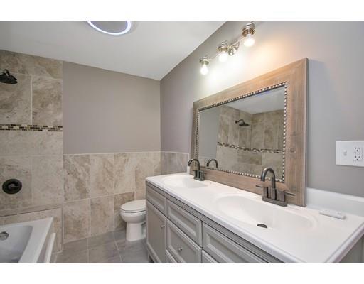 41 Florida Street Springfield, MA 01109 - Photo 19 of 23 a bathroom with a sink a toilet a mirror and shower
