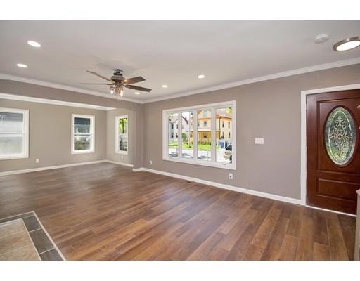 41 Florida Street Springfield, MA 01109 - Photo 3 of 23 a view of an empty room with a window and wooden floor