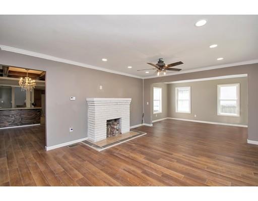 41 Florida Street Springfield, MA 01109 - Photo 4 of 23 a view of an empty room with window and wooden floor