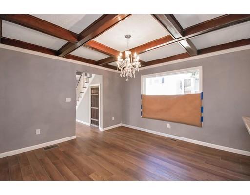 41 Florida Street Springfield, MA 01109 - Photo 6 of 23 a view of an empty room with wooden floor and a ceiling fan