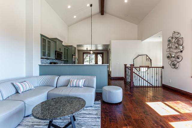 5326 North Oldgate Road Heber City, UT 84032 - Photo 4 of 32 Vaulted ceilings with exposed wood beams complement the rich wood-finish flooring