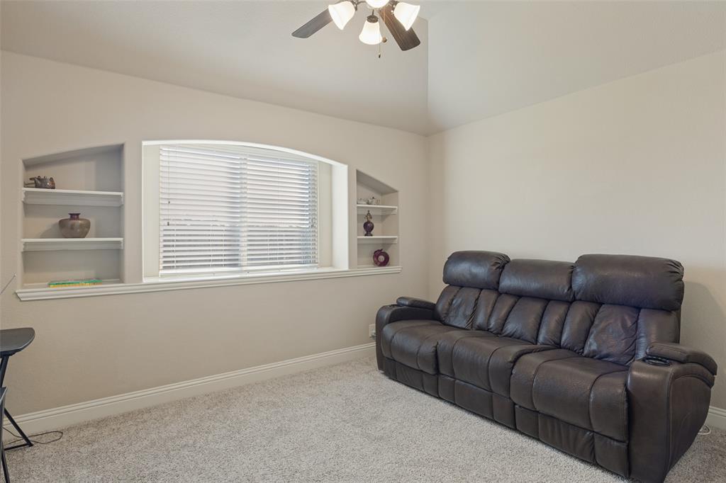 3405 Fletcher Road Heartland, TX 75114 - Photo 14 of 30 Secondary bedroom which has shelves and large window,